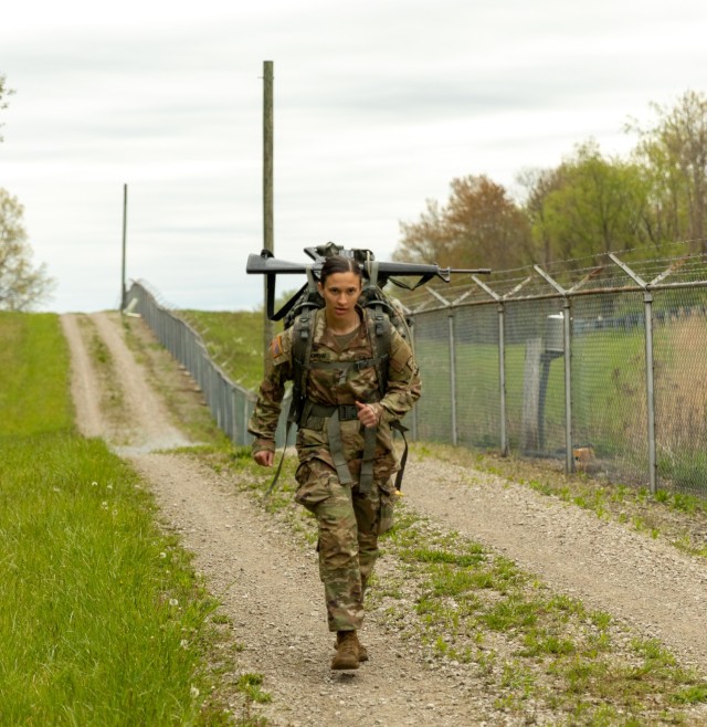 Sgt. Taylor Reichow, multiple launch rocket system crewmember, Battery B, 1st Battalion, 121st Field Artillery Regiment, 157th Maneuver Enhancement Brigade, Wisconsin Army National Guard, keeps pace during the 12-mile ruck march event at the 2023...