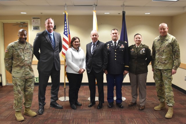 Winners of the 2023 Army Inspector General of the Year Competition are flanked by U.S. Army Col. Isaac Manigault, left, the acting deputy inspector general, and Sgt. Maj. Larry Orvis, the inspector general sergeant major, at the Pentagon, Arlington, Virginia, March 30, 2023. From second left, the winners are: William Foster, Linda Nogle, Robert Faucher, Lt. Col Brett Jordan, and Sgt. 1st Class Dariana Baric. More than 40 inspectors general from all three components of the Army participated in the competition. (U.S. Army photo by Thomas Ruyle)