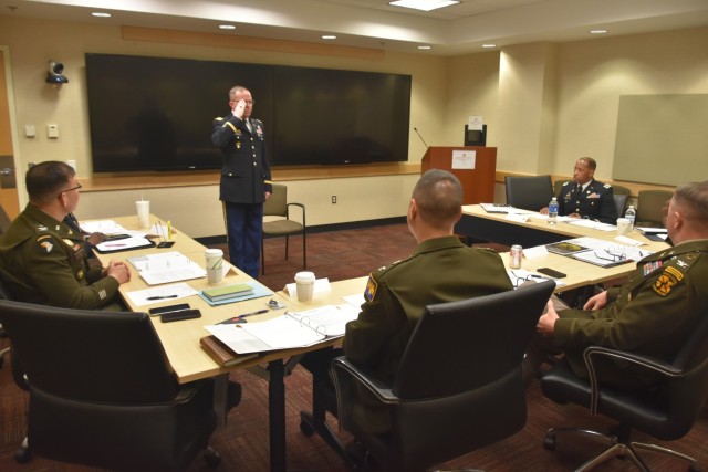 U.S. Army Lt. Col. Theodore Kaiser, assigned to the 10th Army Air and Missile Defense Command, renders a salute as he appears before the commissioned officer board during the Inspector General of the Year Competition at the Pentagon in Arlington,...