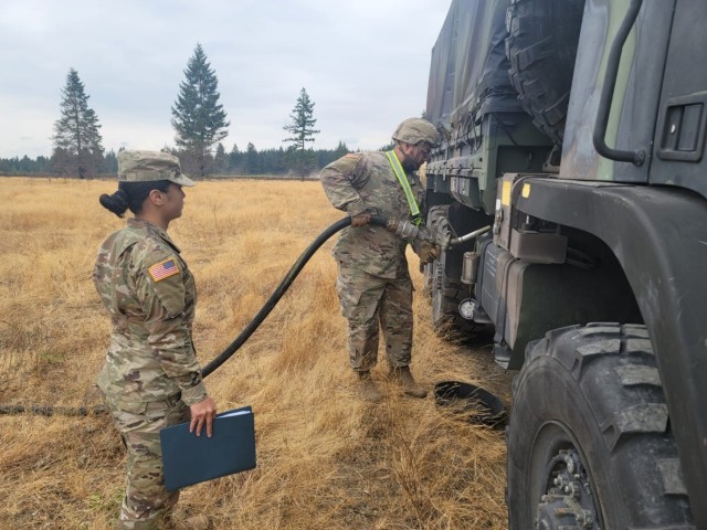 Staff Sgt. Rista Lujan observes Spc. Damien Benway refueling a Light Medium Tactical Vehicle during a Sustainment Best By competition Oct. 19, 2021, at Joint Base Lewis-McChord, Washington.