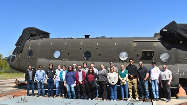 DEVCOM Analysis Center’s Young Professionals pose for a group shot in front of a Chinook Transport Helicopter as they wrapped up their tour of DAC&#39;s Airbase Experimentation Facilities located at Aberdeen Proving Ground, Md. The group seeks to give fresh employees the chance to gain comradery and meet fellow team members, all while exploring what their new work environment has to offer.

(Group photo from left to right)
Giovanni Guillen, Micah Calderwood, Michael Reed, Robert Dorsey, Skyla Gongaware, Samuel Dobson, Josh Wollenweber, Jaben Beiler, Mason Lipford, Richard Standaert, Victoria Greenberg, Caroline Zellhofer, Abigail Heinson, Richard Haberstroh, Julianne Nierwinski, Jordan Shiel, Craigh Riley and Christina A.