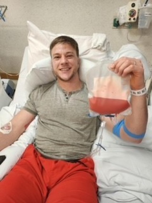 Tanner Schuldt shows off the successful harvesting of more than 10 million cells before they are shipped to the recipient from the UW Health University Hospital, located in Madison, Wisconsin.