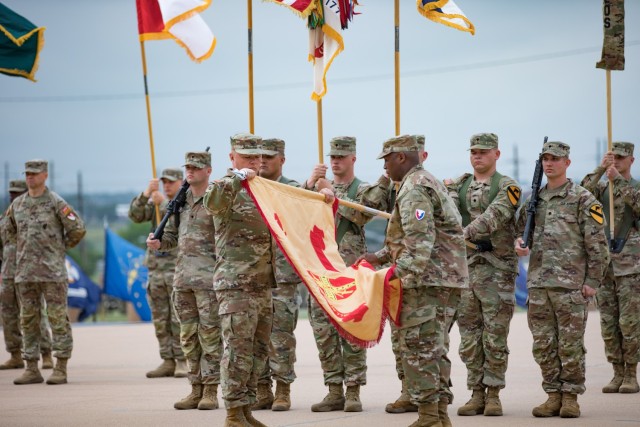 Col. Chad R. Foster and Command Sgt. Maj. Calvin Hall, Garrison command team for Fort Cavazos, case the Fort Hood flag during the Installation Redesignation Ceremony May 9, 2023, at III Armored Corps and Fort Cavazos Headquarters. (U.S. Army photo by Blair Dupre, Fort Cavazos Public Affairs)