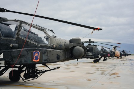 U.S. Army Soldiers, assigned to 1st Battalion, 3rd Aviation Regiment, 12th Combat Aviation Brigade, line up multiple AH-64 Apache helicopters prior to starting their mission during Swift Response 23 at the Stefanovikeio Airport in Greece, May 9, 2023.