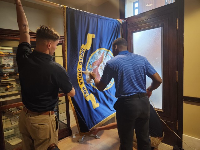 Two members of the Joint Armed Forces Color Guard steam the U.S. Navy flag prior to colors presentation at the 2023 NFL Draft on April 27, 2023, in Kansas City, Missouri. The color guard represented all six branches of the military with service members from Washington, D.C. 