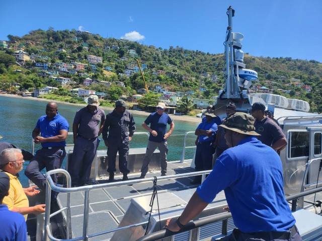 Caribbean Basin Security Initiative (CBSI) Technical Assistance Field Team (TAFT) personnel discuss Utility Boat operations on the waters off St. Kitts  during recent training in the Eastern Caribbean Sea. The TAFT consists of U.S. Coast Guard and U.S. Army personnel that provide maintenance and operational readiness support to 13 Caribbean nations. These efforts enhance regional security by improving partner maritime security capacity. The U.S. Army Security Assistance Command, through its Security Assistance Training Management Organization, provides the Army personnel that make up this TAFT.