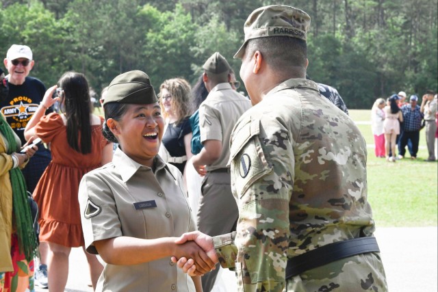 Pfc. Patricia Rose Limbaga greets Brig. Gen Richard Harrison after her Basic Combat Training graduation, May 11. Harrison met Limbaga when she delivered two sandwiches to his home and he was instrumental in informing Limbaga about the Future Soldier Preparatory Course.