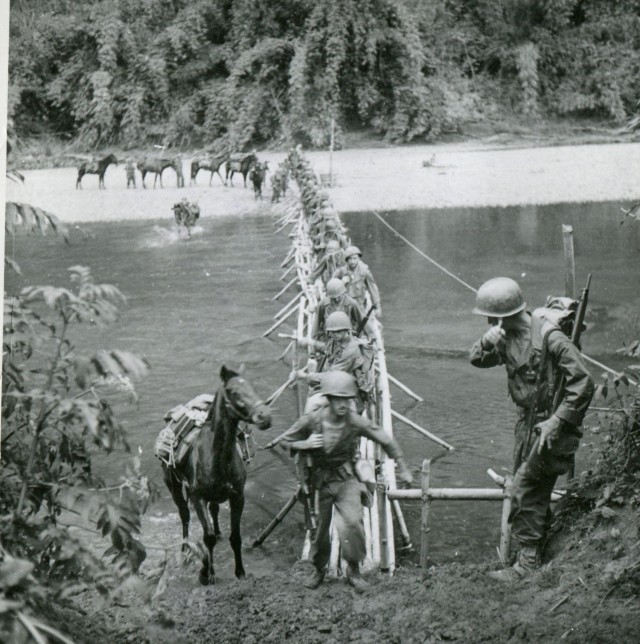 Soldiers from the 5307th Composite Unit (Provisional), popularly known as Merrill’s Maurauders, cross a bridge over the Chindwin River in Northern Burma on March 17, 1944.