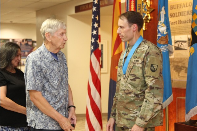 Chief Warrant Officer 5 (retired) Rex A. Williams (left), congratulates Chief Warrant Officer 2 Edward Hennessy