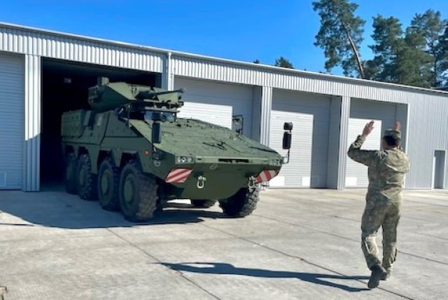 A soldier from Lithuania&#39;s Uhlan Battalion guides a Vilkas infantry fighting vehicle during a visit by Pennsylvania National Guard Soldiers from 1st Squadron, 104th Cavalry Regiment, 2nd Infantry Brigade Combat Team, May 4, 2023, in Alytus, Lithuania.
