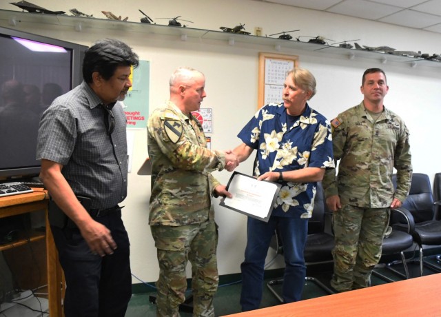 YPG Commander Col. Patrick McFall, YTC Commander Lt. Col. Shane Dering, Command Sgt. Major Herbert Gill, and Technical Director Larry Bracamonte visited the team at Flight Services to recognize them for earning Award of Accomplishment in Safety...