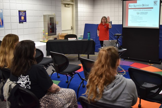 Carol Oberwager, a Sexual Assault Response Coordinator, teaches military spouses the basics of self-defense during the Women’s Self-Defense Class on Friday at Army Community Service’s Military Spouse Appreciation event. 