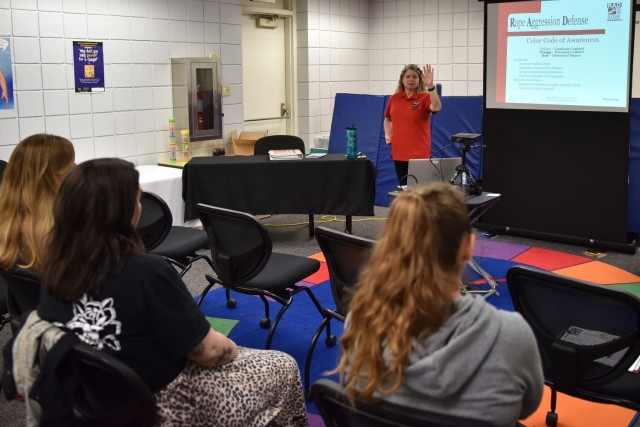 Carol Oberwager, a Sexual Assault Response Coordinator, teaches military spouses the basics of self-defense during the Women’s Self-Defense Class on Friday at Army Community Service’s Military Spouse Appreciation event.