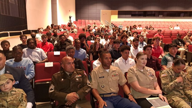 Recruiters from the Air Force, Army, Marines, Navy and Army National Guard sat with their recruits during the Military Enlistment Recognition Program at Shoemaker High School May 10. The event recognized 41 students from Killeen Independent School District. (U.S. Army photo by Janecze Wright, Fort Cavazos Public Affairs)