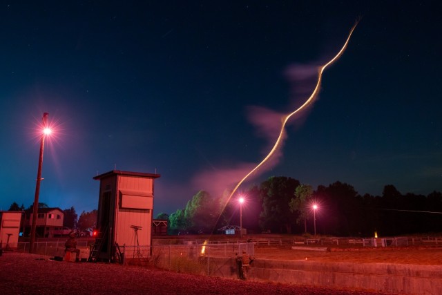 A flare is fired over the night infiltration course (NIC) as Cadets from 3rd Regiment, Basic Camp, advance through the course, Fort Knox, Ky., July 27, 2022. Cadets low crawled approximately 150 meters in the dark with the sights and sounds of a simulated battlefield all around them, overcoming obstacles in their path, such as logs and barriers. | Photo by Kyle Crawford, U.S. Army Cadet Command Public Affairs