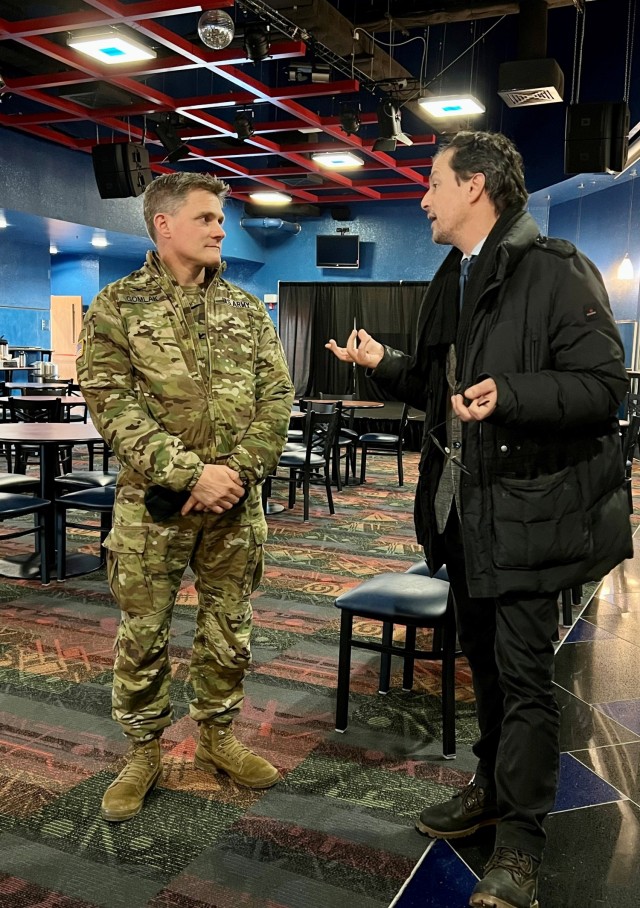 VICENZA, Italy - Col. Matthew Gomlak, commander, U.S. Army Garrison Italy, and Vicenza Teatro Olimpico artistic director Giancarlo Marinelli discuss partnership opportunities during a visit on Caserma Ederle Feb. 9, 2023. (Photo by Anna Ciccotti)