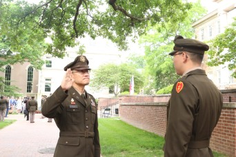 Army chaplain administers oath to son during ROTC commissioning ceremony