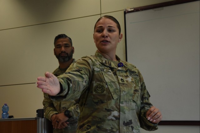 Master Sgt. Ashley Pena, Joint Forces Command – Naples, gives a class on Sexual Harassment/Assault Response and Prevention with the assistance of Staff Sgt. Donavin Castro, Allied Forces South Battalion, during Regulator Week in Naples, Italy. Dozens of U.S. Soldiers assigned to NATO units in Bulgaria, Greece, Italy, Romania and Spain participated in the week-long event to get up to date on Army training, medical and administrative requirements.