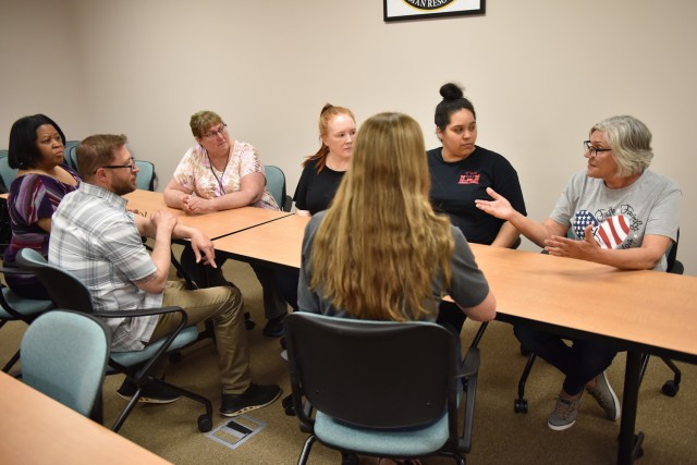 Deborah Abel (right), human resources specialist at Fort Leonard Wood’s Civilian Personnel Advisory Center, meets with teammates prior to her retirement next week. Abel is ending her Department of the Army civilian service after 33 years.