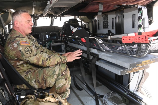 1st Sgt. Patrick Casha, flight paramedic with the Oregon Army National Guard, demonstrates the new MH60M Medical Upgrade Interior (MUI) kit designed for Future Long-Range Assault Aircraft (FLRAA) during EDGE 23 Distinguished Visitor Day at Yuma...