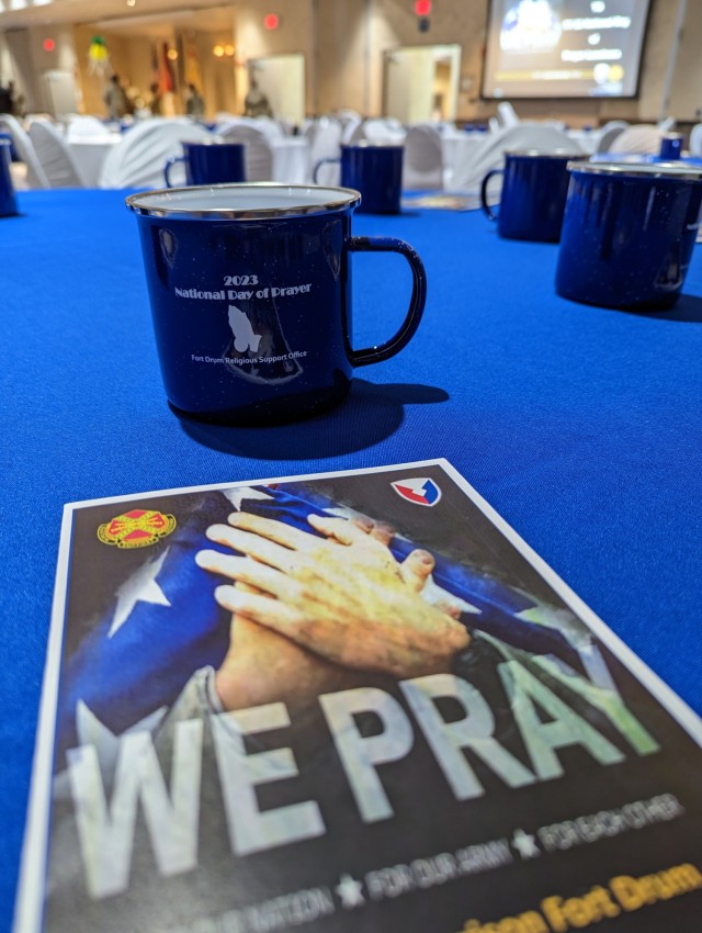Fort Drum community members observe the National Day of Prayer during a luncheon May 24 inside The Peak Ballroom. The event was hosted by the Fort Drum Religious Support Office team, with Chaplain (Col.) James D. Key, 10th Mountain Division (LI) senior command chaplain, as guest speaker. (Photo by Mike Strasser, Fort Drum Garrison Public Affairs)