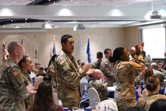 Fort Drum community members observe the National Day of Prayer during a luncheon May 24 inside The Peak Ballroom. The event was hosted by the Fort Drum Religious Support Office team, with Chaplain (Col.) James D. Key, 10th Mountain Division (LI) senior command chaplain, as guest speaker. (Photo by Mike Strasser, Fort Drum Garrison Public Affairs)