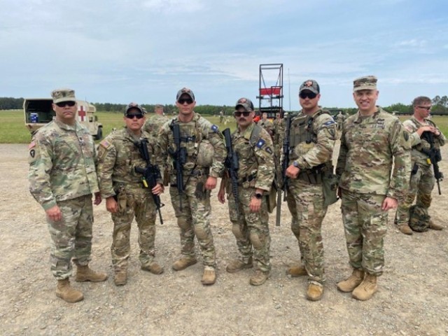 Texas Alpha team stands with the 176th Engineer Brigade command team just before competing in the X lane at the 52nd Annual Winston P. Wilson Championship, April 29-May 5, 2023, in Little Rock, Arkansas. Left to right, Command Sgt. Maj. Corey Chester, Sgt. 1st Class Stephen Duron, Sgt. 1st Class Charles Stevener, Capt. Ross Buntyn, 1st Lt. Samuel Slichter, Col. Kevin Crawford.
