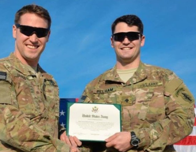 Spc. John Pelham (right) was killed in action on Feb. 12, 2014, in Kapisa Province, Afghanistan, in support of Operation Enduring Freedom. His name is etched on the Memorial Wall at U.S. Army Special Operations Command Headquarters.