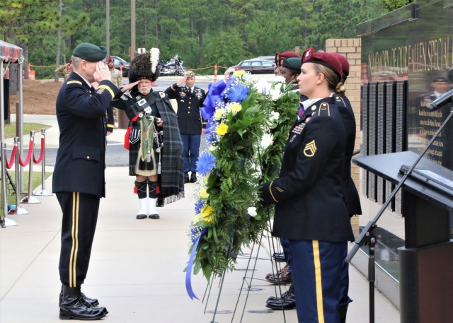 U.S. Army Special Operations Command Commanding General, Lt. Gen. Jonathan Braga, salutes in memory of fallen Army Special Operations Soldiers at the Memorial Plaza on Fort Bragg, N.C. May 25.