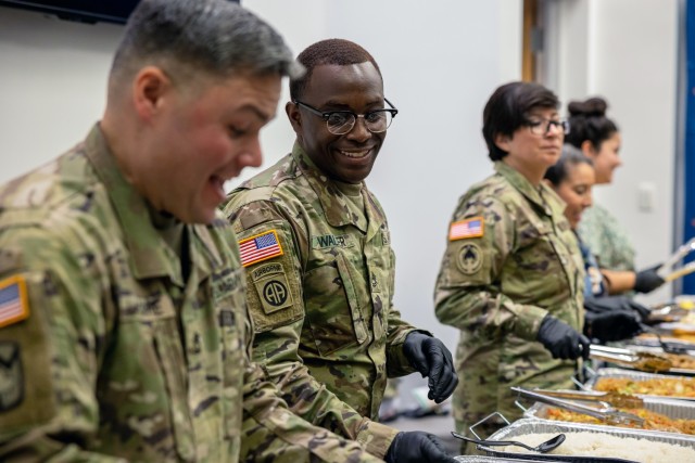 Soldiers with Army Futures Command’s Support Battalion dish up traditional dishes from Hawaii, the Philippines and China during the command’s Asian American Pacific Islander Heritage Month observance.