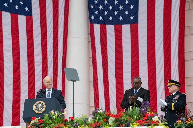 President Joe Biden delivers a speech during a Memorial Day commemoration, May 29, 2023. Secretary of Defense Lloyd Austin and Chairman of the Joint Chiefs of Staff Gen. Mark Milley look on.