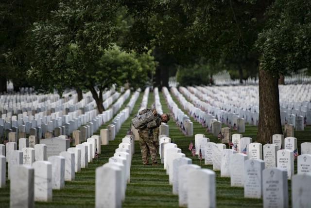 Soldiers from the 3d U.S. Infantry Regiment (The Old Guard) place U.S. flags at gravesites in Section 60 of Arlington National Cemetery, Arlington, Va., May 25, 2023. This was the 75th anniversary of Flags In where over 1,000 service members placed more than 260,000 flags at gravesites at Arlington National Cemetery and the U.S. Soldiers’ and Airmen’s Home National Cemetery.