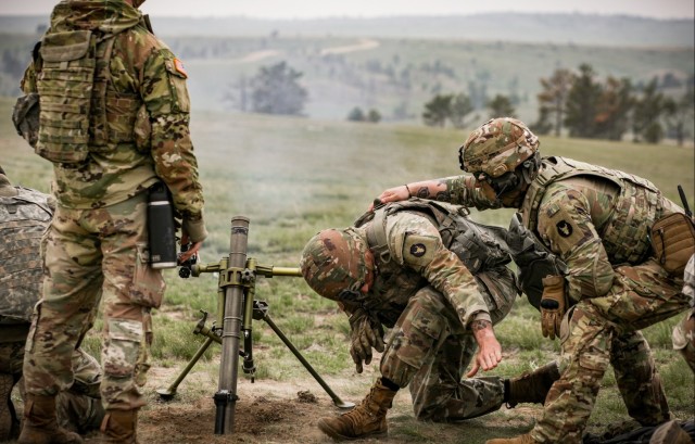 Iowa infantrymen fire 60 mm mortar