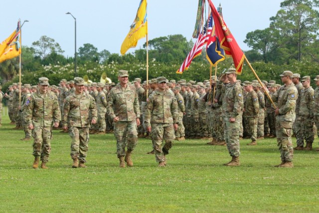 Col. Armstrong (left), Col. Moon (middle left), Major General Costanza (middle right), and Major Perez (right) troop the line during the change of command ceremony on Fort Stewart, Georgia May 31, 2023. Trooping the line is a long honored...