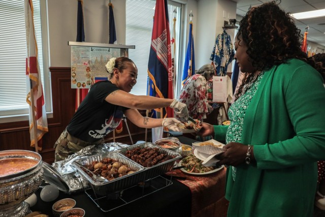Chief Warrant Officer 4 Chendi Sar, senior human resources advisor to the Army Materiel Command commanding general, serves a Cambodian dish to an AMC employee during AMC&#39;s Asian American Pacific Islander Month Observance at Redstone Arsenal, Alabama, May 22, 2023. AMC celebrated Asian American Pacific Islander Month with an observance where Myles Miyamasu, AMC deputy G-3, served as the guest speaker. 