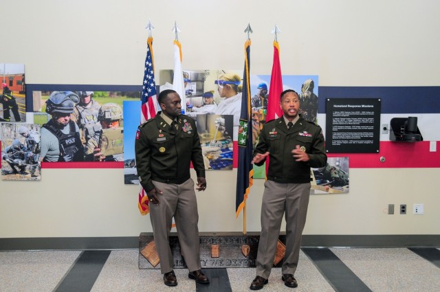 Brig. Gen. Daryl O. Hood (right) and Chief Warrant Officer 4 Jesse S. Deberry (left)