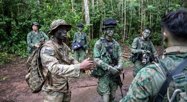 25th Infantry Division Soldiers trained side-by-side with the Singapore Armed Forces Soldiers on May 11, 2023 during Tiger Balm 2023. The Soldiers trained in the steep Hawaiian mountainsides, deep in the jungle. The training was designed to test a combined U.S.-Singapore Division-Level coalition task force.