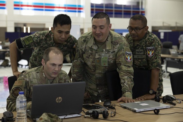 Malaysian and U.S. Armed Forces service members complete a mission analysis during the staff exercise of Bersama Warrior 23 at the Joint Warfighting Center on Malaysian Armed Forces Headquarters Base, Kuantan, Padang, Malaysia, June 5, 2023. The annual Bersama Warrior exercise is sponsored by U.S. Indo-Pacific Command and hosted by the Malaysian Armed Forces. (U.S. Marine Corps photo by Gunnery Sgt. Alexandria Blanche)