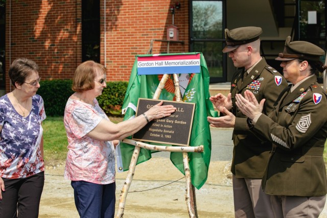 Mrs. Betty Gordon and LTC Trent Colestock unveil the plaque for Gordon Hall