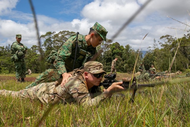 A Singaporean Soldier, top, assists a U.S. Soldier during live fire training as part of Exercise Tiger Balm. The 25th Infantry Division and Singapore Armed Forces [SAF] practiced Joint Battle Drills, integrating techniques, and procedures they would use in live fire operations during Exercise Tiger Balm 2023 The 278th Armored Calvary Regiment, Tennessee National Guard, also exchanged decision making best-practices with SAF during a simultaneous Command Post Exercise. Exercise Tiger Balm strengthens the capabilities and interoperability of our partnership, improving our ability to operate seamlessly together the U.S. Army&#39;s partnership with the Singapore military. 