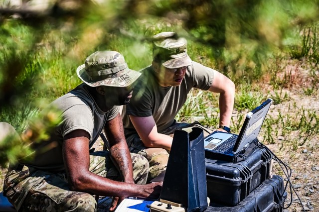 Sgt. Byme Taylor, 1st Battalion, 175th Infantry Regiment infantryman, left, and Spc. Hyung Kang, 1st Battalion, 175th Infantry Reigment infantryman, assemble an RQ-11 Raven signal antenna at Joint Base McGuire-Dix-Lakehurst, New Jersey, June 1, 2023. The drone provides day or night aerial intelligence, surveillance, target acquisition and reconnaissance.