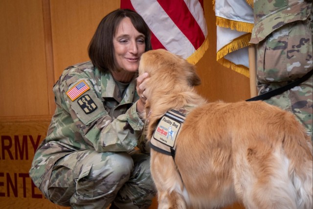 Newly pinned Air Force major accepts his duty with nose bop, paw salute ...