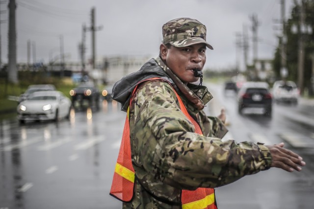 Spc. John Tun of Binadu Company, 1-294th Infantry Regiment, Guam National Guard, operates a traffic control point in Barrigada May 31, 2023, as part of the disaster response to Typhoon Mawar. The Category 4 storm, which packed 150 mph winds, knocked out power, water, and other critical services to the approximately 160,000 U.S. Citizens of Guam.
