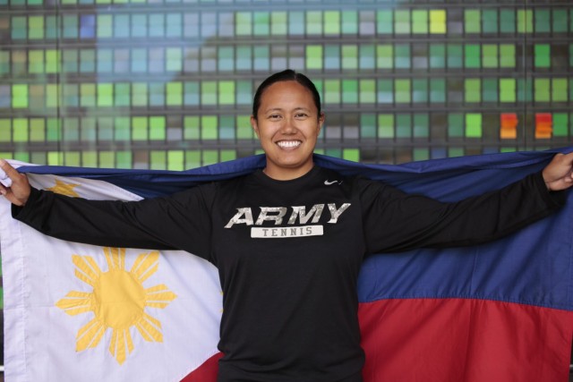 Maj. Jurelle Mendoza, Assistant Product Manager supporting the Tactical Intelligence Targeting Access Node (TITAN) Pre-Prototype and the Tactical Space Layer (TSL) for Army Tactical Exploitation of National Capabilities (TENCAP), holding the flag of the Phillippines