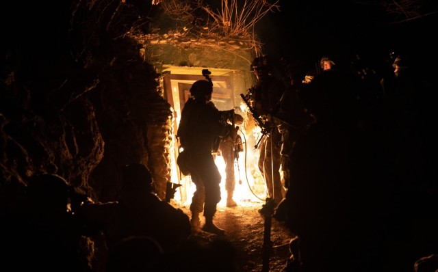 A Soldier with 2nd Brigade, 2nd Infantry Division breaches the entrance of an underground complex during the early morning on March 16, 2023 at Goldmine Training Area, Republic of Korea during Exercise Warrior Shield.