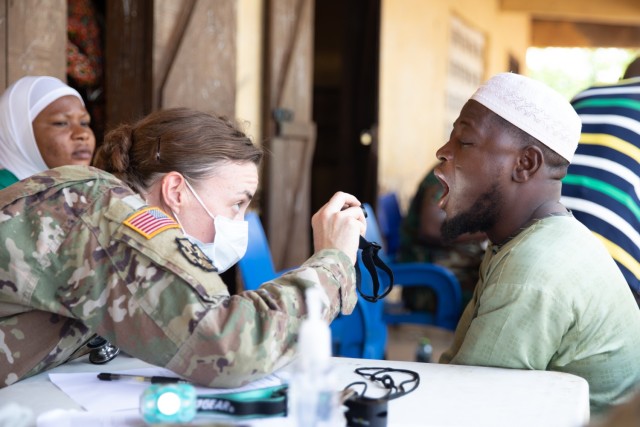 An emergency medicine physician with the U.S. Army 352nd Civil Affairs Command, diagnoses a Ghanaian civilian near Yendi, Ghana, June 3, 2023.