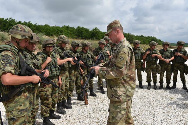 Sgt. Joshua Stiles, assigned to the Ohio National Guard’s Military Police Company, instructs members of the Serbian Armed Forces on non-lethal weapons tactics during Exercise Platinum Wolf 2018, June 15, 2018. (Ohio National Guard photo by...