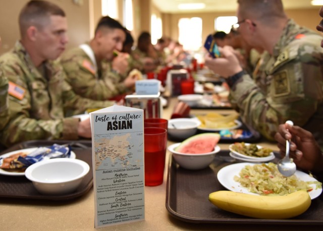 Soldiers with Company C, 84th Chemical Battalion, take a break from training to enjoy the Asian cuisine offered at the Schrum Dining Facility for lunch on June 13, as part of Army Heritage Month. 