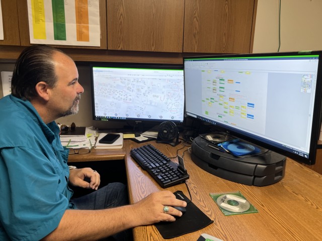 Kirk Farmer, manager of the Utility Monitoring and Control System, uses the UMCS to remotely monitor and manage more than 200 facilities. (U.S. Army photo by Christine Luciano, DPW Environmental)