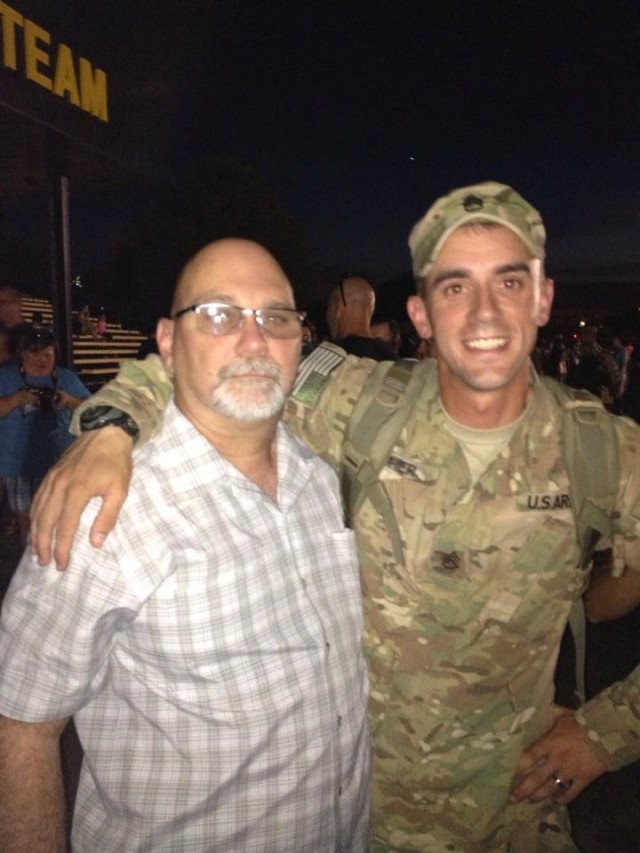 Sgt. 1st Class Ean Eicher with his dad after redeploying from Afghanistan, circa 2013.